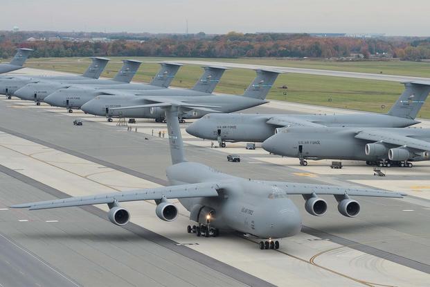 A C-5M Super Galaxy aircraft taxis with other C-5Ms in the background Nov. 2, 2015, at Dover Air Force Base, Delaware. (U.S. Air Force photo/Greg L. Davis)