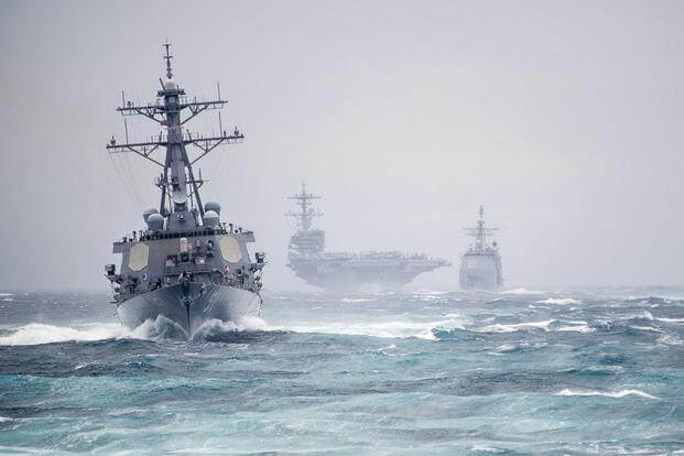 Ships from the George H.W. Bush Carrier Strike Group simulate a strait transit in the Atlantic Ocean on Dec. 10, 2013. Officials say reaching a 355-ship fleet by 2050 may not be realistic. Mass Communication Specialist 2nd Class Justin Wolpert/Navy