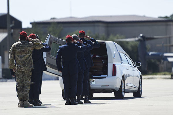 Special Tactics Airmen salute the remains of Staff Sgt. Forrest B. Sibley during a dignified transfer on Hurlburt Field, Fla., Sept. 14, 2015. (U.S. Air Force/Airman Kai White)