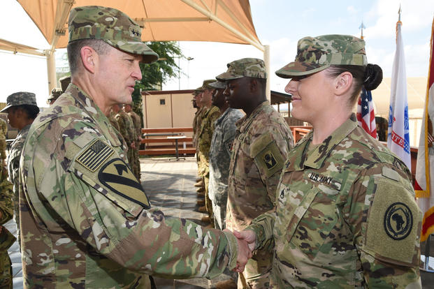 Vice Chief of Staff of the Army Gen. Daniel B. Allyn recognizes Army Staff Sgt. Kendra Langsford for outstanding performance as an intelligence noncommissioned officer at Camp Lemonnier, Jan. 16, 2017. (U.S. Air National Guard/Master Sgt. Paul Gorman)