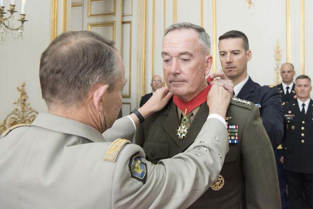 Marine Corps Gen. Joseph F. Dunford Jr., chairman of the Joint Chiefs of Staff, receives the Legion of Honor from French Gen. Pierre de Villiers, Chief of the Defense Staff in Paris, July 12, 2017. (DoD/Navy Petty Officer 2nd Class Dominique A. Pineiro)
