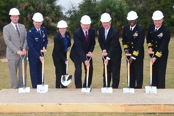 Matthew Hantzmon; Col. Matthew W. Higer; Miranda A.A. Ballentine; Dennis V. McGinn; Stan Connally; Capt. Keith W. Hoskins; and Capt. Todd A. Bahlau marked the start of construction for three solar electric generating facilities. (U.S. Navy/Mike O'Connor)