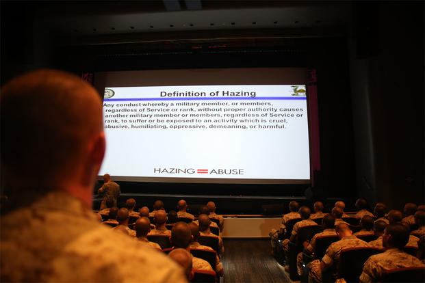 A recruit of Echo Company, 2nd Recruit Training Battalion, reads the definition of hazing to his fellow recruits at Marine Corps Recruit Depot San Diego, Oct. 7, 2014. (Marine Corps photo by Cpl. Tyler Viglione)