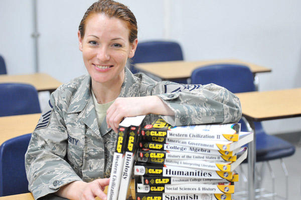 Airman with textbooks.