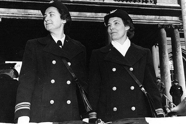 Circa 1943, Navy Reserve Lt. Cmdr. Mildred H. McAfee and Coast Guard Reserve Lt. Cmdr. Dorothy Stratton watch 418 women take the oath to join the Navy and Coast Guard in front of New York City Hall. (U.S. Navy)