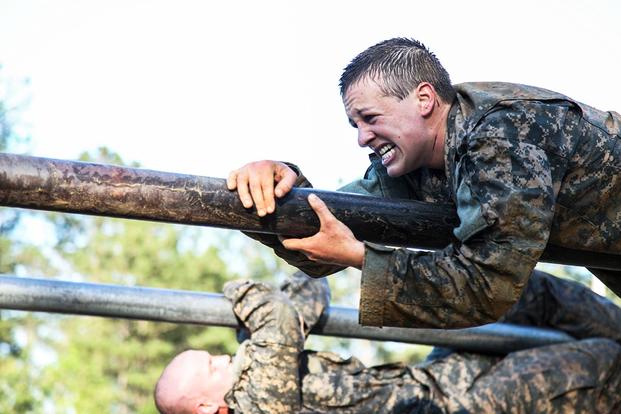 U.S. Army Soldiers use teamwork to scale an obstacle during the Ranger Course on Fort Benning, Ga., April 21, 2015. Soldiers attend the Ranger Course to learn additional skills in a challenging environment. (U.S. Army/Pfc. Antonio Lewis/Released)
