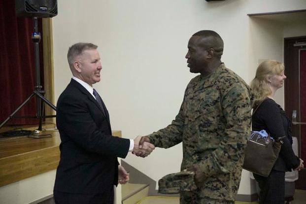 Justin Constantine (left) received a Purple Heart for his service in Iraq with the U.S. Marine Corps. 