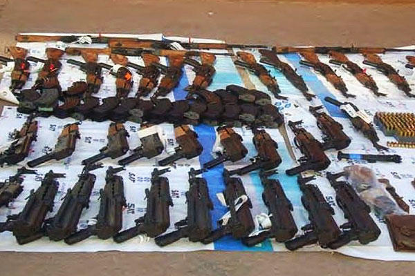 42 weapons recovered by Mexican military in Naco, Sonora, Mexico. Weapons were investigated by U.S. ICE. (U.S. Dept. of Justice photo)