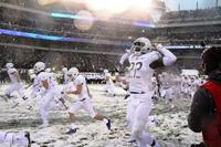 Army defensive back Ke'Shaun Wells flexes as he runs onto the field before the 118th Army-Navy Game, Dec. 9, 2017, at Lincoln Financial Field in Philadelphia.  (Photo by Steve Whitman/Military.com)