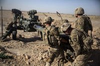 Army soldiers maneuver a howitzer in Afghanistan. U.S. troops have occasionally come under scrutiny for acting on their own to stop child abuse in the country. (US Marine Corps photo/Justin Updegraff)