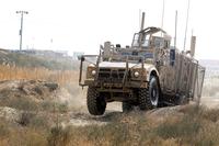 An Oshkosh Defense mine-resistant, ambush-protected vehicle All-Terrain Vehicle (MAT-V) bumps across ruts in the off-road portion of the master driver training course at Bagram Airfield, Afghanistan on Nov. 8, 2017. Spc. Elizabeth White/Army