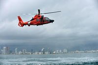 Petty Officer 3rd Class Bryan Evans, a Coast Guard Air Station Miami rescue swimmer, prepares for a free fall deployment from a MH-65 Dolphin helicopter east of Miami Beach on June 6, 2017. (Coast Guard photo/Eric D. Woodall)