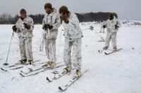 Marines with Charlie Company, Battalion Landing Team, 1st Battalion, 1st Marines, 31st Marine Expeditionary Unit, take a short break during ski and sled drills as part of company unit-level training at Camp Sendai, Miyagi, Japan, Feb. 21, 2018. (Stormy Mendez/Marine Corps)