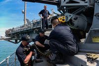 Sailors load a close-in weapon system aboard the aircraft carrier USS Theodore Roosevelt, April 6, 2018. (U.S. Navy photo/Andrew Langholf)