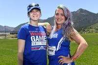 Medically retired Air Force Senior Airman Karah Behrend and her sister Crystal Boyd pose for a photo at 2018 Warrior Games at the Air Force Academy in Colorado Springs, Colo. June 2, 2018. The sisters met for the first time in person at the games. (DoD photo/EJ Hersom)