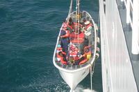 Haitians being lowered down into Port-au-Prince Bay for repatriation. (Photo: Courtesy of Sarah Holzhalb)