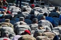 Attendees participate in memorial push-ups during Tech. Sgt. John Chapman’s name unveiling ceremony at the Air Force Memorial, in Arlington, Va., Aug. 24, 2018. Chapman was posthumously awarded the Medal of Honor for actions on Takur Ghar mountain in Afghanistan on March 4, 2002. (DeAndre Curtiss/Air Force)