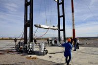 Engineers lower an air-launched cruise missile following a test at the EMP facility at the White Sands Missile Range in New Mexico. (ATEC photo/John Hamilton)