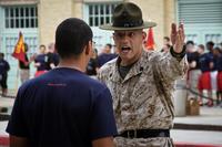 Staff Sgt. Dale R. Barbitta, a drill instructor at the United States Naval Academy, talks to a poolee from Marine Corps Recruiting Station Baltimore during their statewide pool function at the USNA. (U.S. Marine Corps/Cpl. Bryan Nygaard)