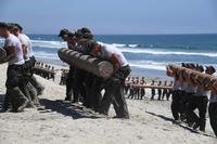 First Phase Basic Underwater Demolition/SEALs candidates participate in log physical training at Naval Amphibious Base Coronado, July 14, 2016. (U.S. Navy photo by Mass Communication Specialist 2nd Class Timothy M. Black)