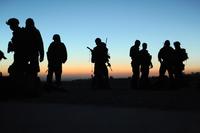 Afghan Commandos and U.S. Special Forces from Special Operations Task Force-East await movement for an operation, Nov. 28, 2010. (U.S. Army/Sgt. Justin Morelli)