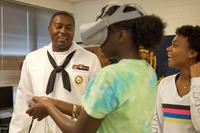 Logistics Specialist 2nd Class Rashad Archie, a recruiter assigned to Navy Recruiting District Jacksonville, uses virtual reality goggles to show members of Edgewater High School’s Junior Reserve Officers’ Training Corps what it is like to serve in the Navy during Navy Recruiting Command's “Swarm” Orlando evolution. (Kyle Hafer/U.S. Navy)