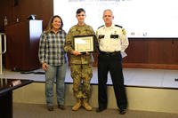 Oak Grove City Chief of Police Dennis Cunningham (right), and Oak Grove City Mayor Theresa Jarvis (left), present Spc. Sebatian Gorder with a letter of appreciation, March 6, 2019 at Fort Campbell. (U.S. Army photo/James M. Griffin)