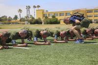 Recruits of Kilo Company, 3rd Recruit Training Battalion, conduct planks during the bases and circuit course event at Marine Corps Recruits Depot San Diego, June 28, 2016. (U.S. Marine Corps/Lance Cpl. Angelica Annastas)