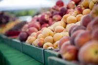 Peaches sit, waiting to be picked up before the start of the first Farmers’ Market on Travis Air Force Base, California. (U.S. Air Force/Senior Airman Nicole Leidholm)