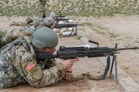 Soldiers with the 159th and 160th Financial Management Support Detachment prepare to fire at targets down range with their M249 squad automatic weapons at the Florence Military Reservation firing range on March 8, 2019. After zeroing their weapons, soldiers must receive a minimum score of 35 in controlled bursts in order to pass Army qualification on the M249 squad automatic weapon. (Mykaela Martin/U.S. Army)