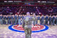 Army Colonel Jeffrey D. Witt, Chief of Staff of U.S. Army Tank-automotive &amp; Armaments Command administers the Oath of Enlistment at a joint enlistment ceremony during halftime at the Detroit Pistons Hoops For Troops game.(U.S. Navy/Mass Communication Specialist 1st Class Stephen D. Doyle II)