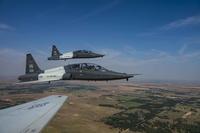 Pilots from the 25th Flying Training Squadron and the 5th Flying Training Squadron soar through the sky in T-38C Talons on July 25, 2019, over Oklahoma. The T-38 Talon is a twin-engine, high-altitude, supersonic jet trainer used in a variety of roles across the Air Force. (U.S. Air Force photo by Senior Airman Taylor Crul)
