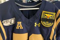 A Navy linebacker will wear a Naval Aviation Schools Command patch in honor of three victims who were shot and killed on Dec. 6, 2019 at Naval Air Station Pensacola. (U.S. Naval Academy)