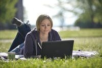 woman working on a laptop outside