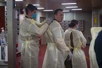 The patient transport team prepares to receive a patient aboard the hospital ship USNS Comfort