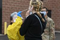 Members of the Minnesota National Guard conduct COVID-19 testing.