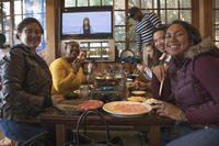 people sitting around restaurant table