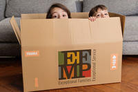 children's head peeking out of box