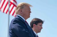 President Trump and Secretary of Defense Dr. Mark T. Esper bow their heads during an invocation.