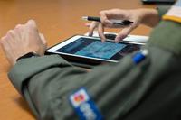 1st Lt. Ryan Smithies finalizes mission planning before departing into Hurricane Douglas.
