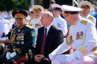 President Vladimir Putin, center, Admiral Nikolai Yevmenov, Commander-in-Chief of the Russian Navy, right, and Russian Defense Minister Sergei Shoigu 