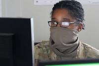Military member studying ASVAB on a computer screen