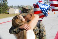 couple kissing after deployment