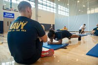 Retail Services Specialist 2nd Class Danielle Young performs a plank during a new physical readiness test (PRT) as part of Navy Physical Readiness Test Evaluation Phase II in 2019. In 2021, the plank will be a mandatory event for all sailors. (Class Cole C. Pielop/Navy)