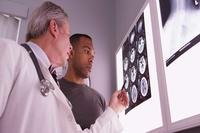 Doctor and patient examining brain scans