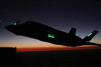 An F-35B Lightning II aircraft conducts nighttime aerial refueling training operation.