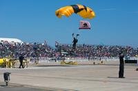 A U.S. Army Soldier with the Golden Knights Parachute Team lands after performing aerobatics during the 2016 Marine Corps Air Station (MCAS) Miramar Air Show at MCAS Miramar.