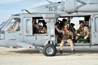 Navy Seal Team 5 prepares for fast-rope exercise.