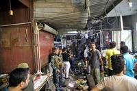 Bomb kills at least 25 in Sadr City, Iraq.