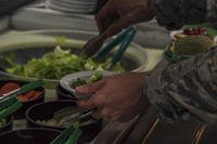 Airman hits salad bar at Japanese base.